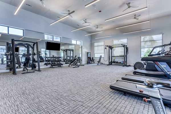 State-of-the-art fitness center at Tacara Dove Creek Apartments featuring modern equipment and spacious workout areas for residents