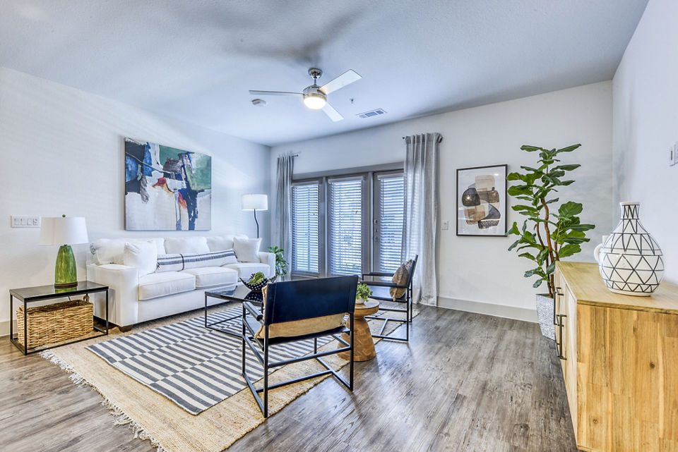 Modern living room with stylish furnishings in Tacara Dove Creek Apartments, offering luxury living in San Antonio