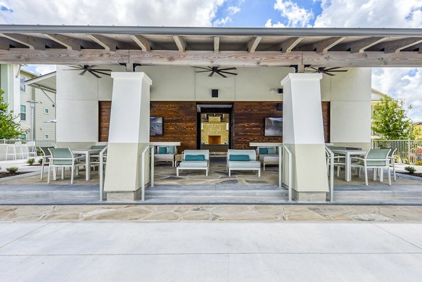 Outdoor patio with stylish seating at Tacara Dove Creek Apartments, perfect for leisure and gatherings