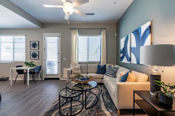 Vlux at Sunset Farms Apartments: Elegant living room with modern furnishings and natural light
