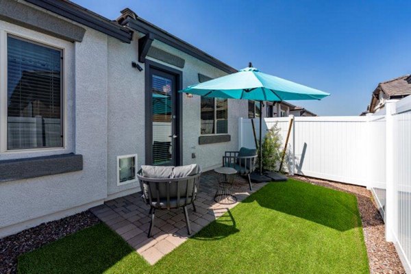 Spacious patio with outdoor seating at Vlux at Sunset Farms Apartments