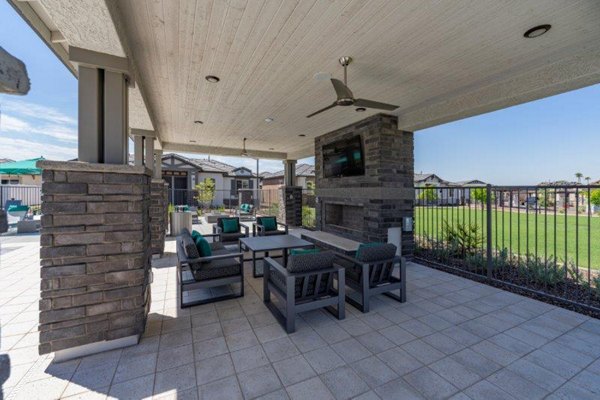 Modern recreation area featuring lounge and game spaces at Vlux at Sunset Farms Apartments