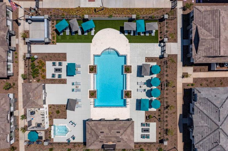 Vlux at Sunset Farms: Scenic view of luxury apartments surrounded by lush greenery