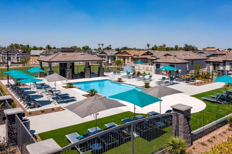 Vlux at Sunset Farms: Scenic view of luxury apartments with lush landscaping