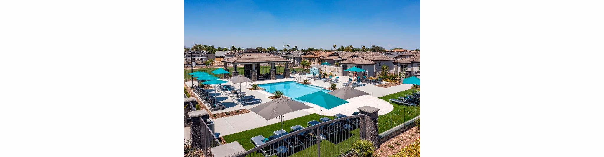 Vlux at Sunset Farms: Scenic view of luxury apartments with lush landscaping