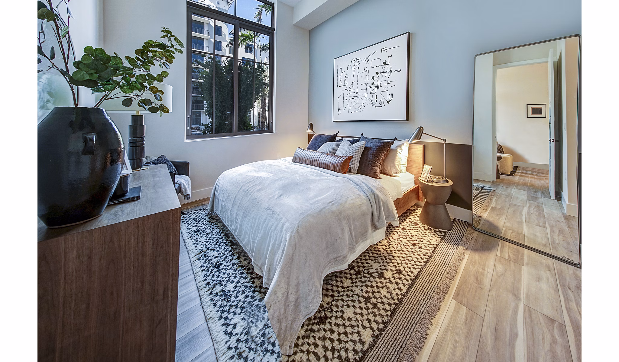 Cozy bedroom with modern decor at The Ellsworth Apartments: Luxury living by Greystar in vibrant city location