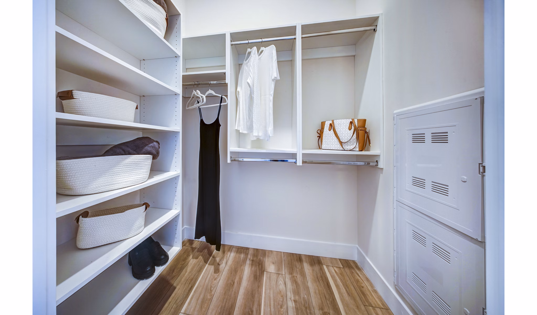 The Ellsworth Apartments: Spacious bedroom closet with custom shelving and ample storage options