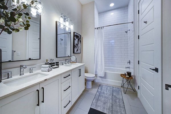 Spacious bathroom with modern fixtures at The Ellsworth Apartments
