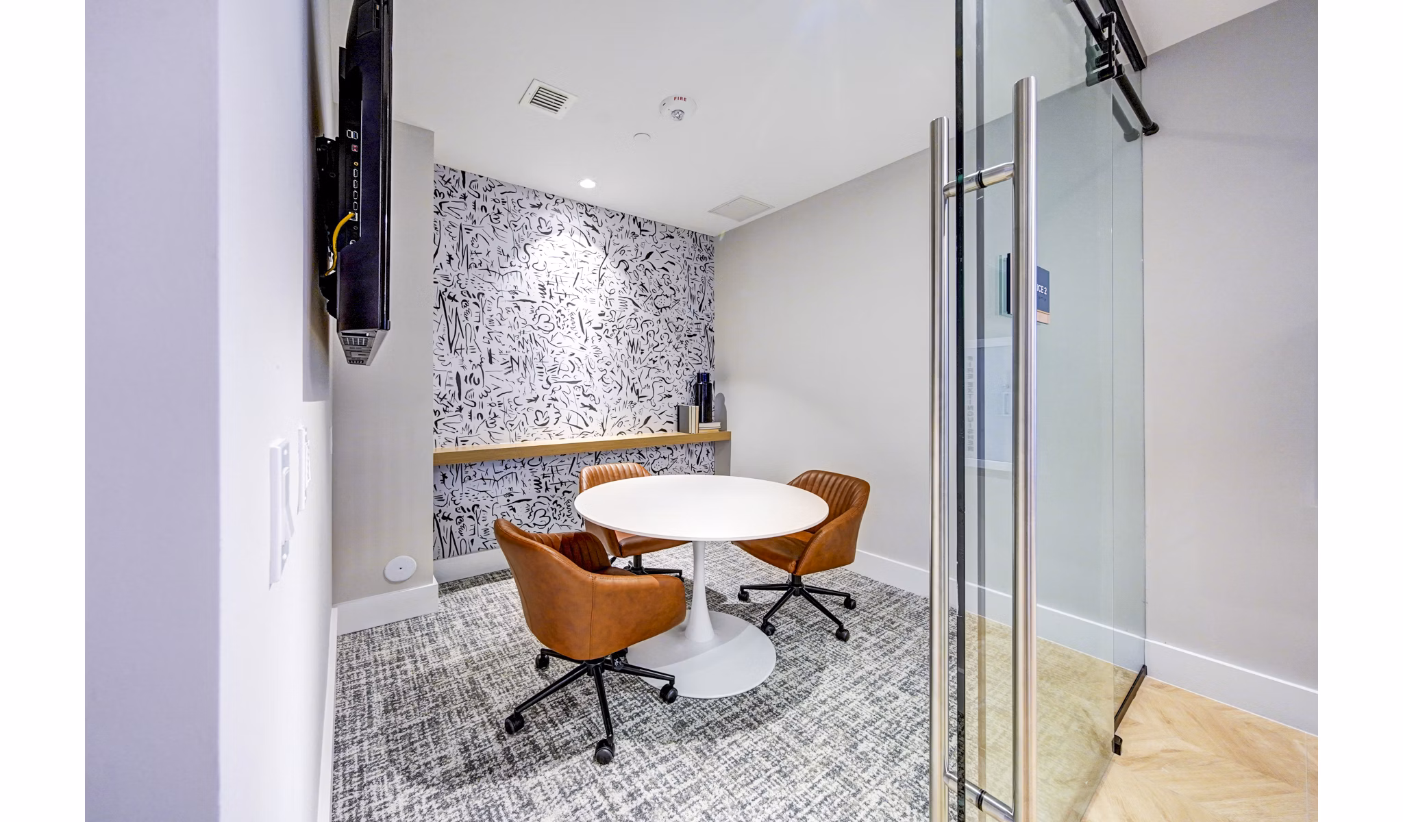 Elegant clubhouse meeting facility at The Ellsworth Apartments, featuring modern design and ample seating for residents and guests