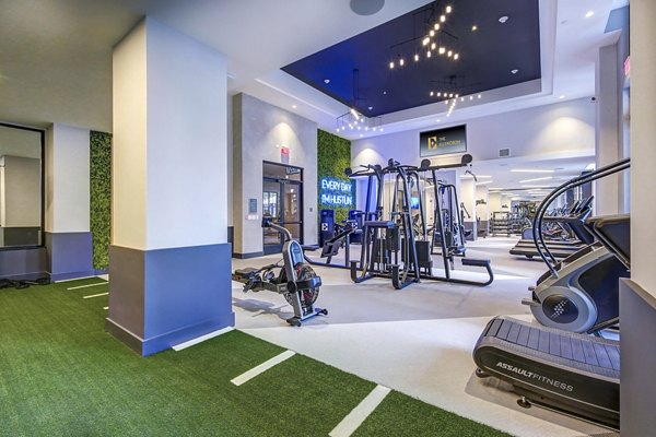 Modern fitness center with state-of-the-art equipment at The Ellsworth Apartments