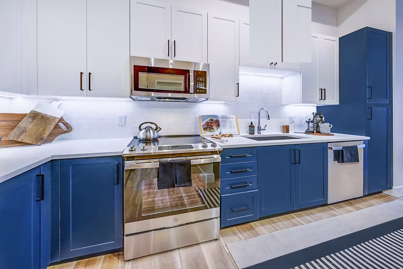 Modern kitchen with stainless steel appliances at The Ellsworth Apartments