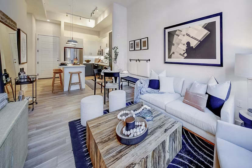 Living room with modern furniture and open layout at The Ellsworth Apartments