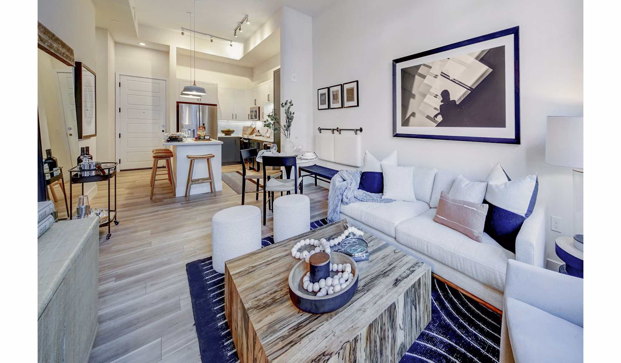 Living room with modern furniture and open layout at The Ellsworth Apartments
