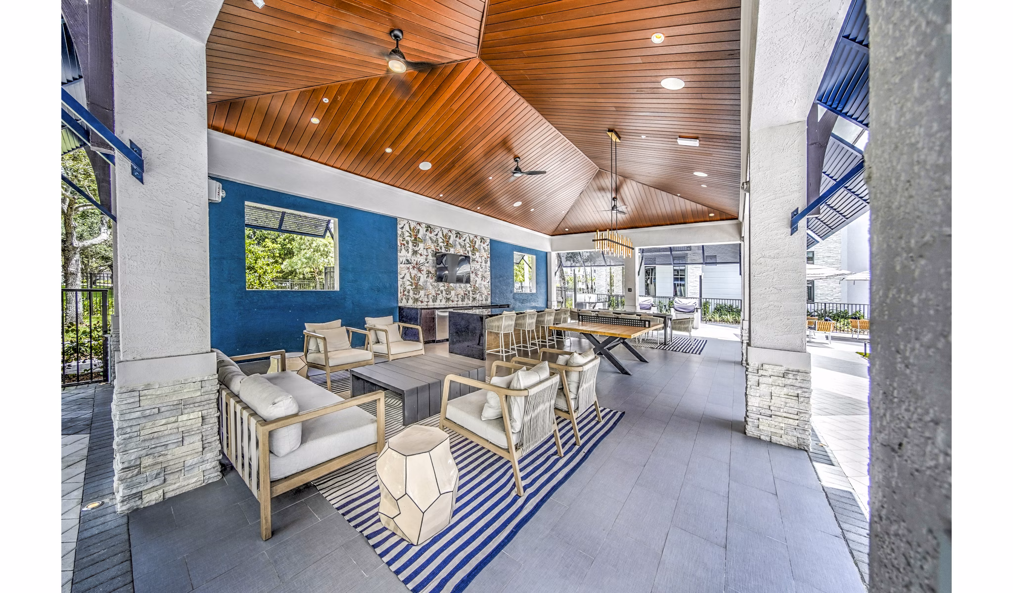Grill area with seating on patio at The Ellsworth Apartments
