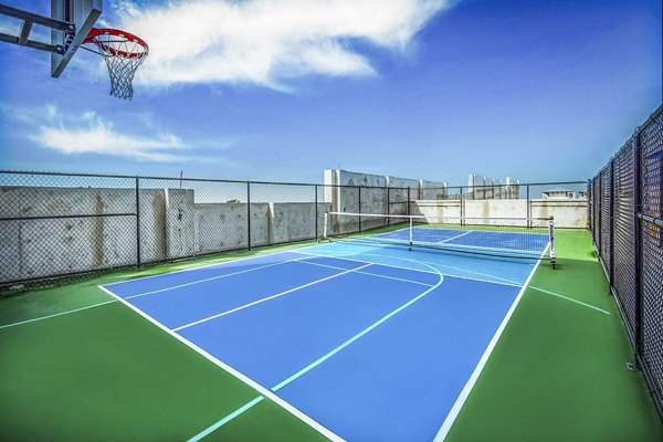 Outdoor tennis court at The Ellsworth Apartments available for residents and guests to enjoy competitive matches and recreational play