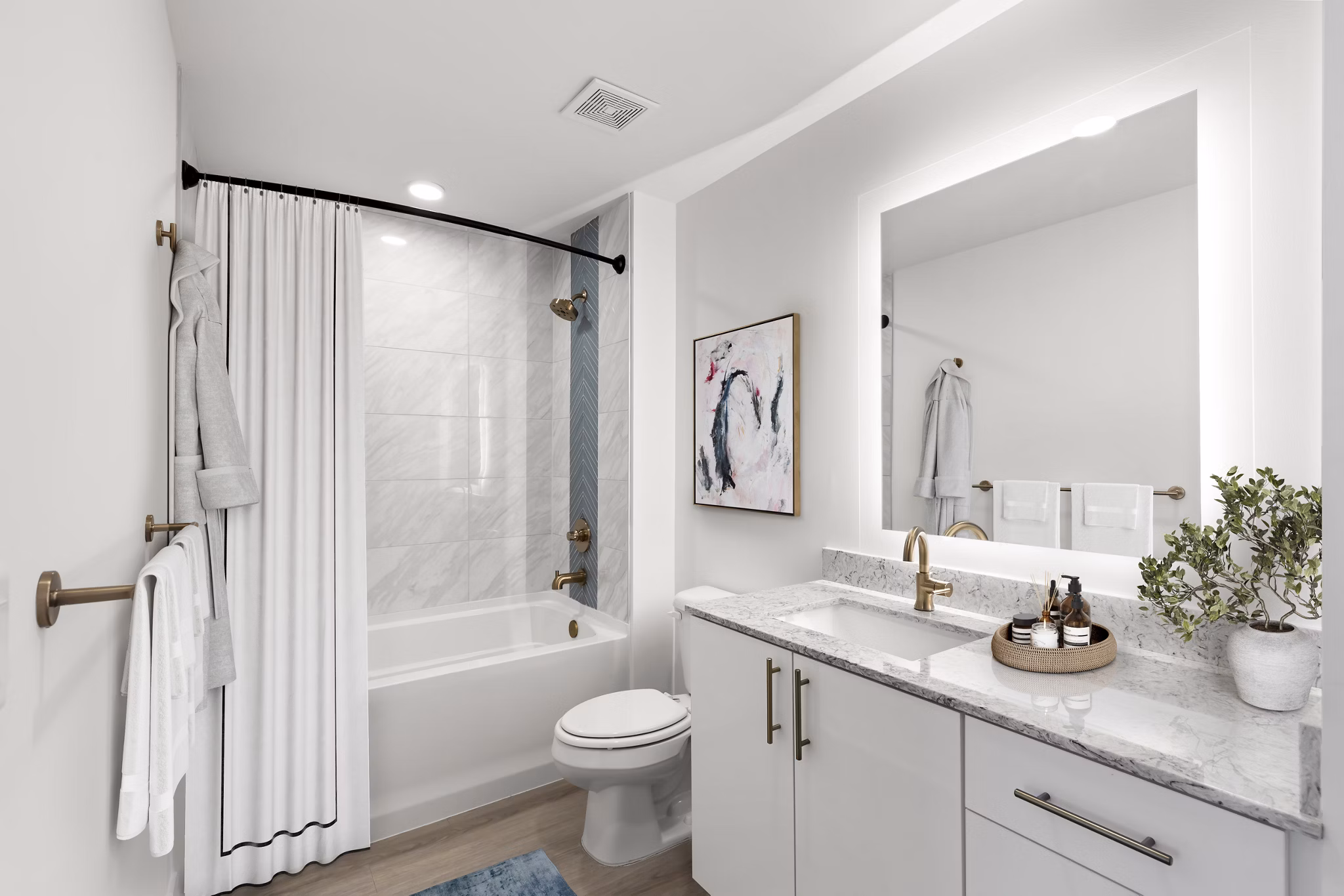 Modern bathroom featuring sleek fixtures and large vanity at Ascent St Petersburg Apartments luxury living