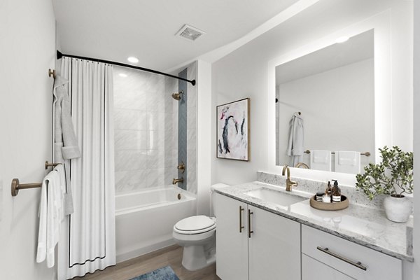 Modern bathroom featuring sleek fixtures and large vanity at Ascent St Petersburg Apartments luxury living