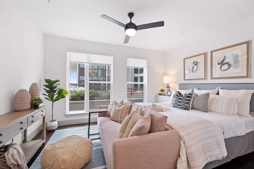 Elegant bedroom with modern decor at The Oliver Apartments