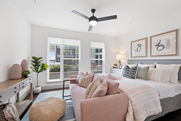 Elegant bedroom with modern decor at The Oliver Apartments