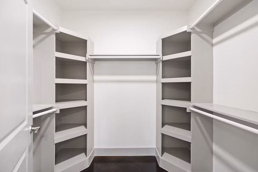 Walk-in closet with custom shelving in The Oliver Apartments