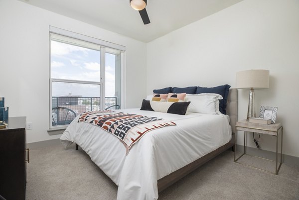 bedroom at The Oliver Apartments