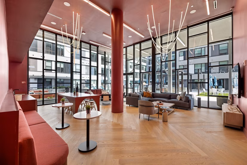 Elegant clubhouse with modern seating and lighting at The Oliver Apartments, perfect for socializing and relaxation
