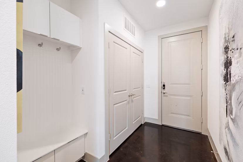 Hallway with modern lighting fixtures at The Oliver Apartments in Greystar's luxury collection