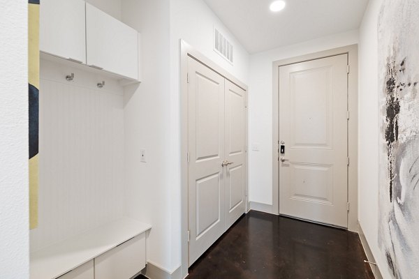 Hallway with modern lighting fixtures at The Oliver Apartments in Greystar's luxury collection
