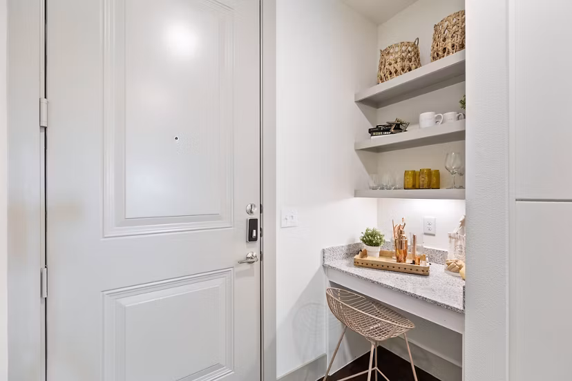 Home office with ergonomic desk and chair in The Oliver Apartments, perfect for remote work in a luxury setting