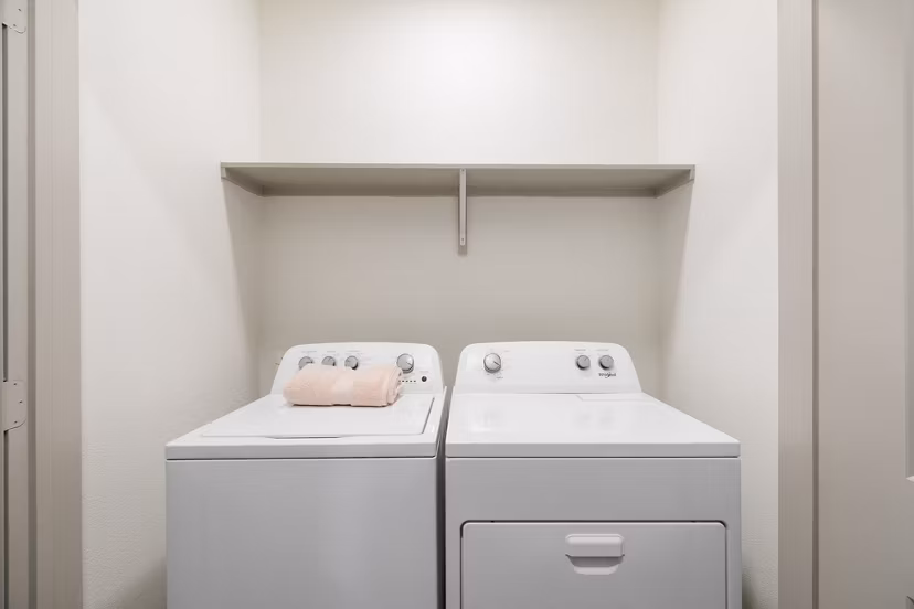 Laundry room with modern appliances in The Oliver Apartments, luxury living spaces by Greystar, perfect for convenience and comfort