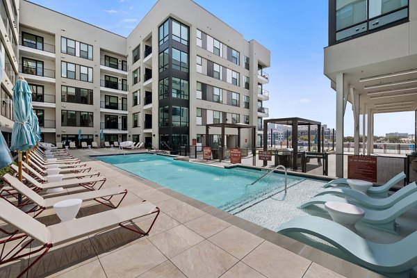 Resort-style pool at The Oliver Apartments offering luxury relaxation in a vibrant community
