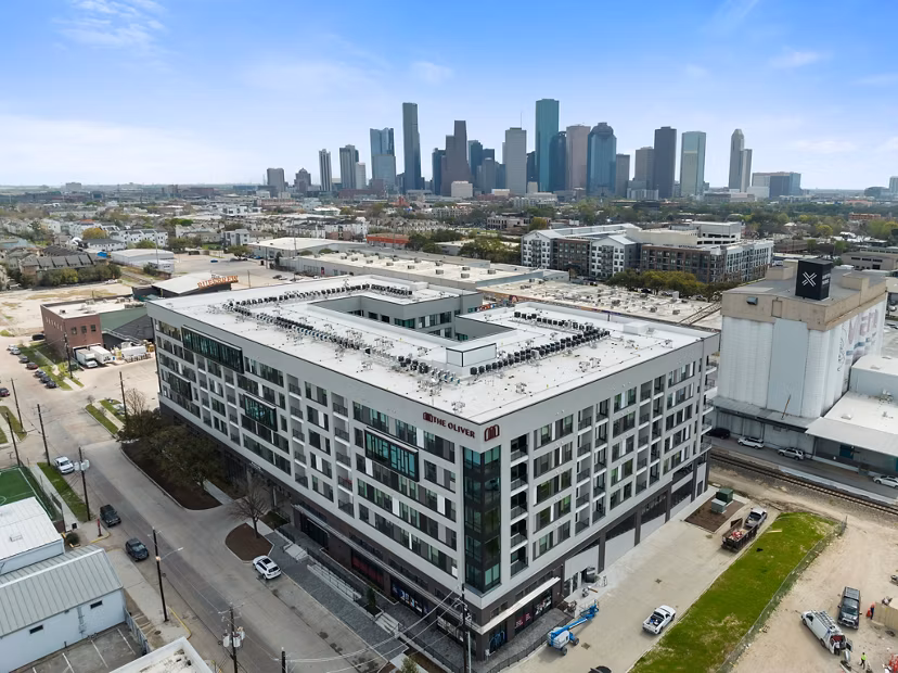 Scenic cityscape view from luxury balcony at The Oliver Apartments, capturing urban charm and modern design
