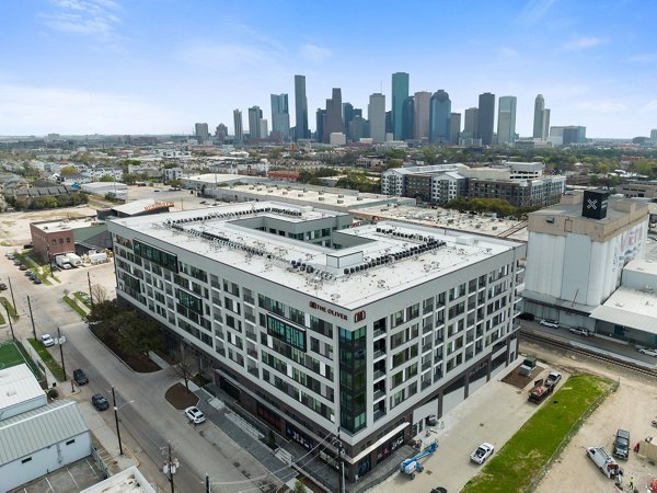 Scenic cityscape view from luxury balcony at The Oliver Apartments, capturing urban charm and modern design