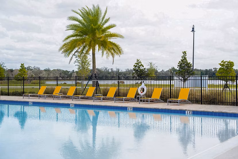 Sparkling outdoor pool at Summerwell Avian Pointe Apartments for luxury relaxation