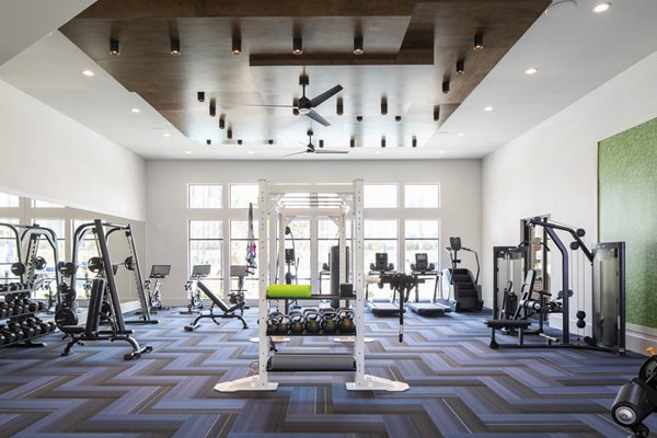 Fitness center with modern equipment at Broadstone Bryson Apartments