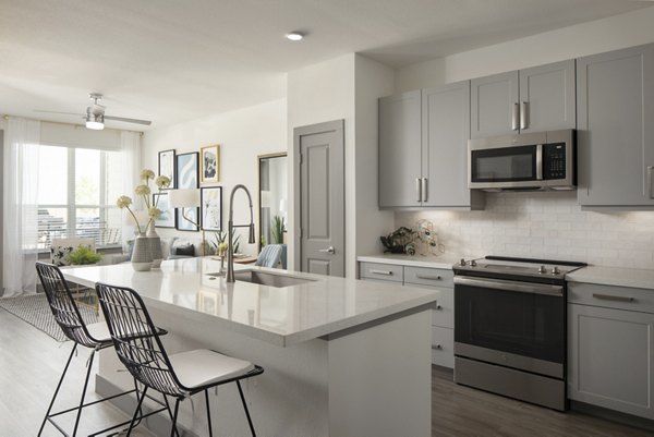 Contemporary kitchen with stainless steel appliances in Broadstone Bryson Apartments