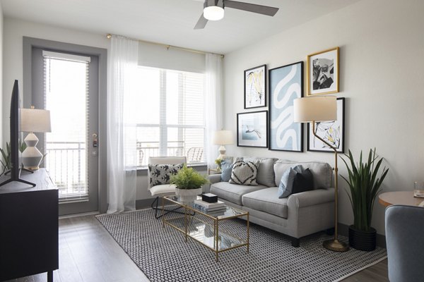 Cozy living room featuring modern furnishings and natural light at Broadstone Bryson Apartments