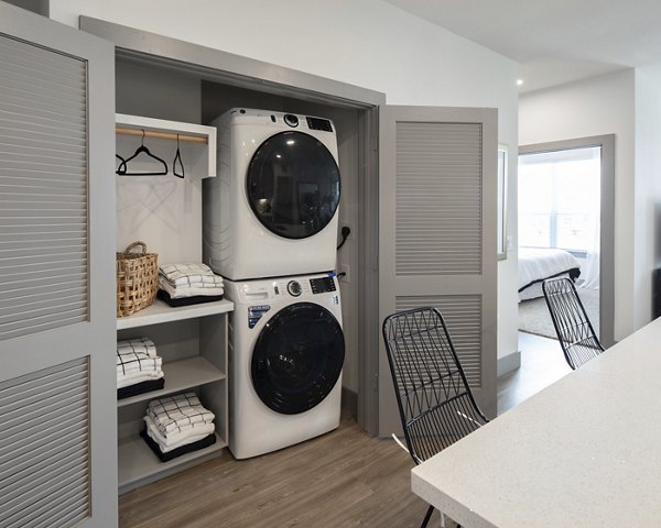 Modern laundry room with energy-efficient washers and dryers in Broadstone Bryson Apartments, offering convenience and style
