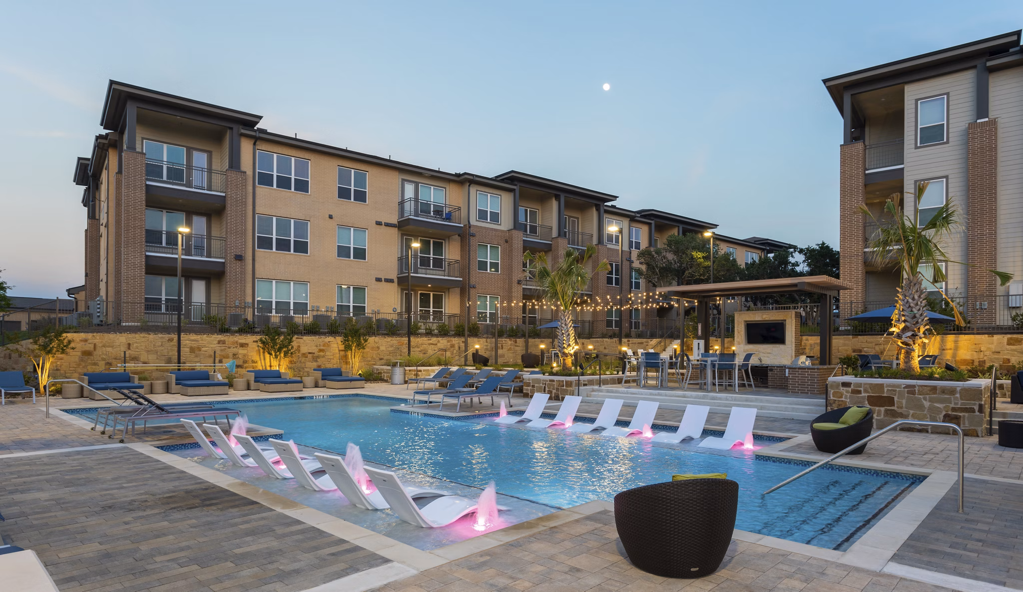 Outdoor pool with lounge chairs at Broadstone Bryson Apartments, a luxurious community with modern amenities in a vibrant setting