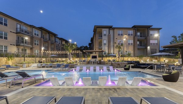 Sunlit pool area with lounge chairs at Broadstone Bryson Apartments