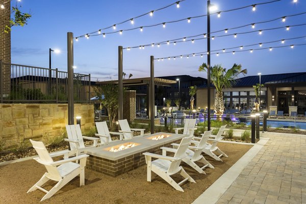 Cozy outdoor fire pit area at Broadstone Bryson Apartments, perfect for evening gatherings and relaxation
