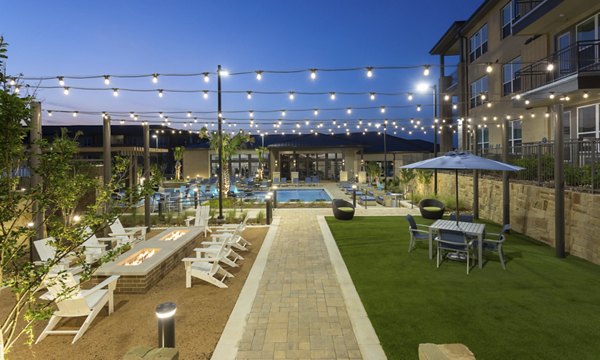 Scenic courtyard with lush greenery and seating areas at Broadstone Bryson Apartments