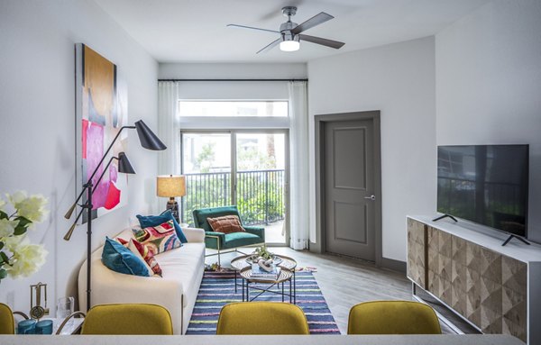 Modern living room with colorful cushions and a coffee table in luxury apartments