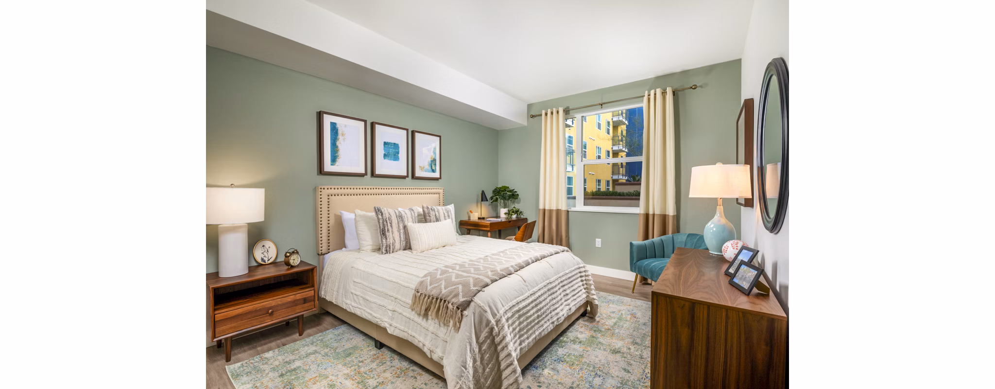 Aston at Gateway Apartments: Cozy bedroom with modern decor and ample natural light