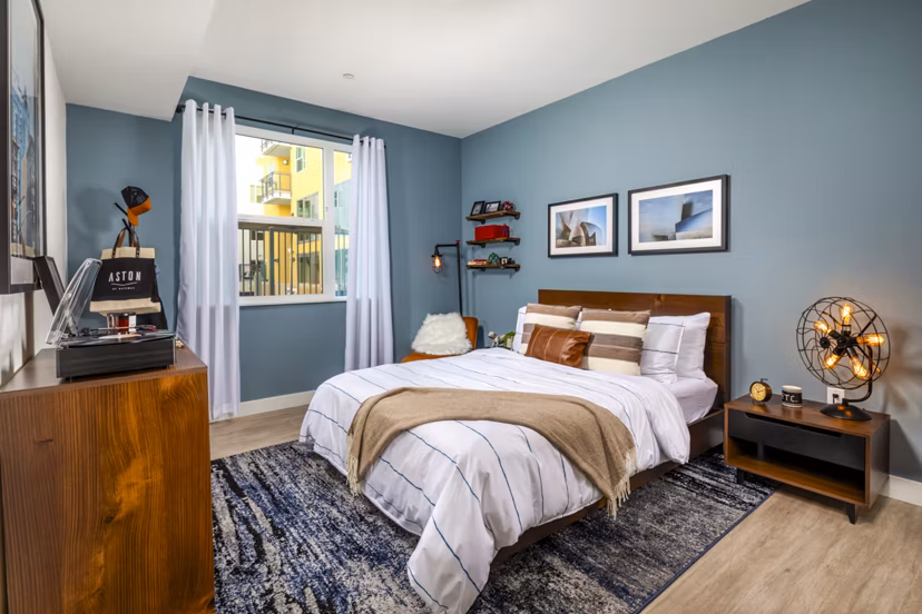 Cozy bedroom with plush bedding in Aston at Gateway Apartments