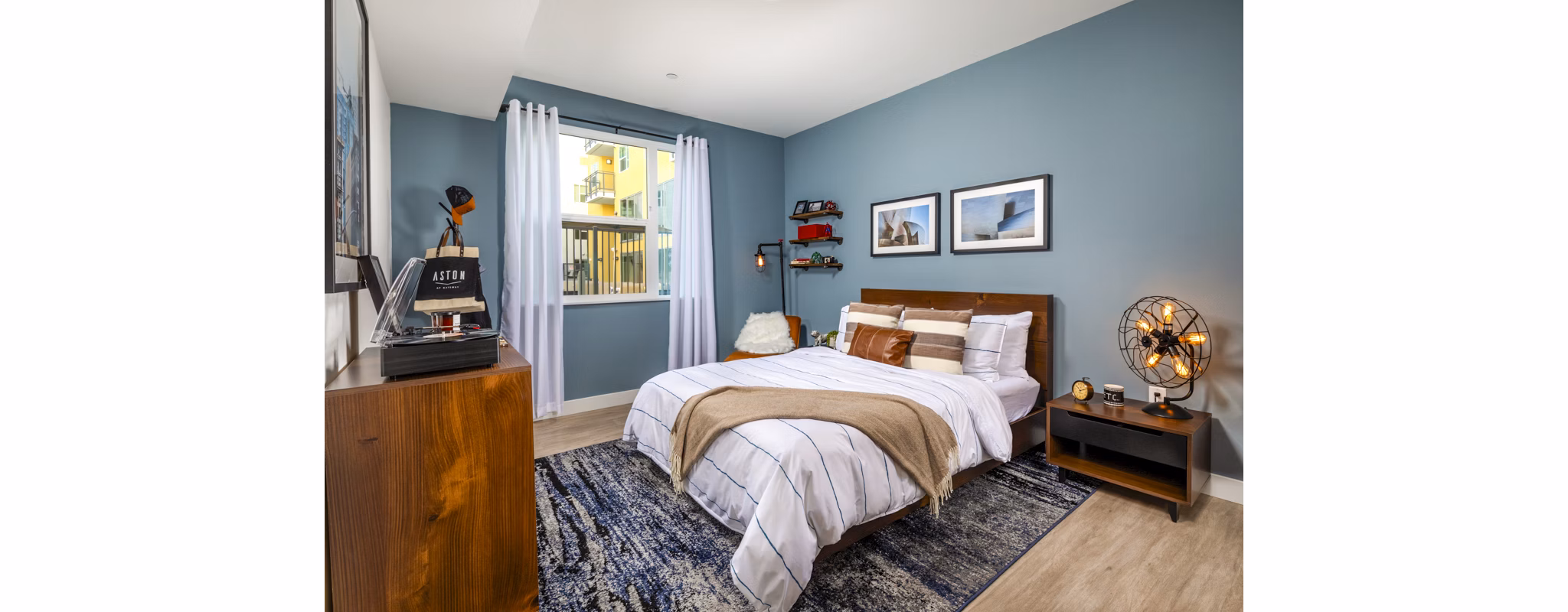 Cozy bedroom with plush bedding in Aston at Gateway Apartments