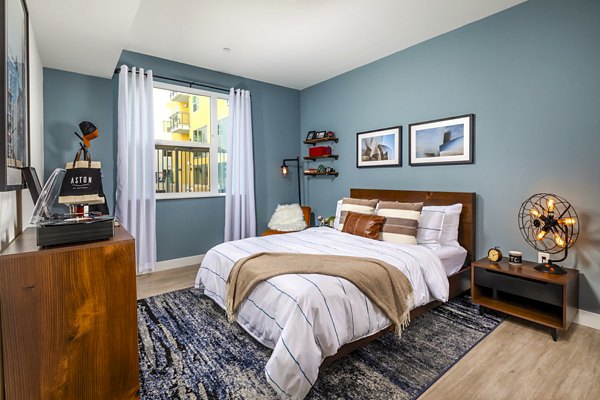 Cozy bedroom with plush bedding in Aston at Gateway Apartments