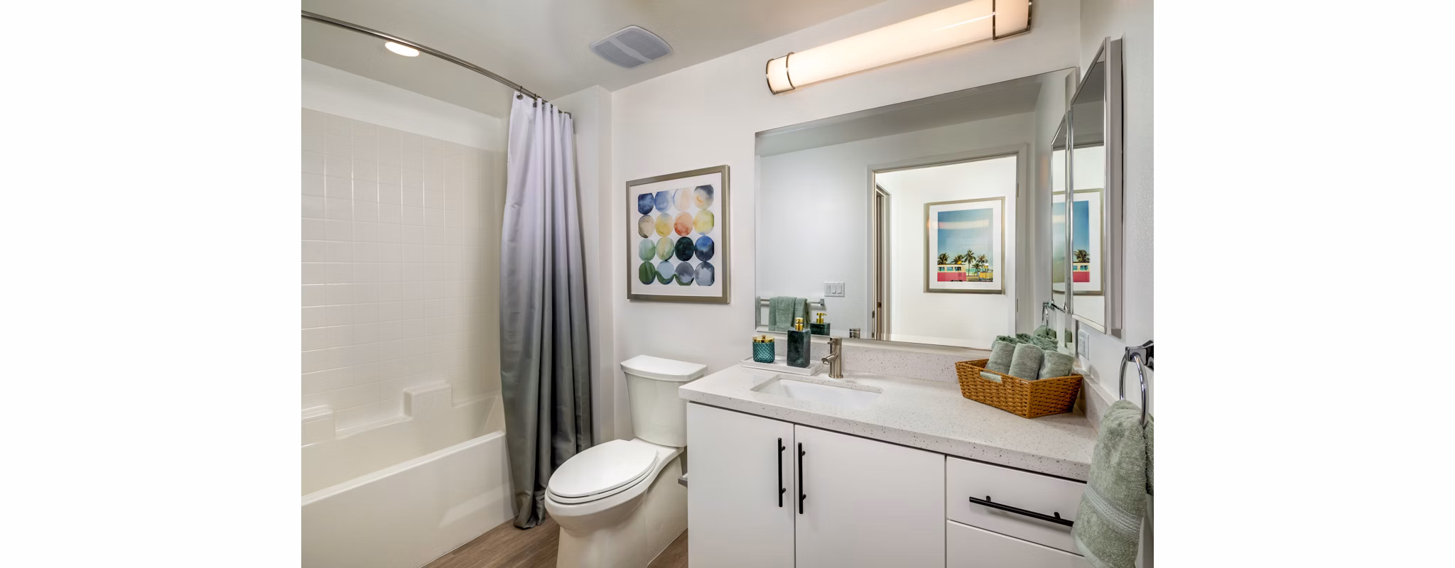 Modern bathroom with sleek finishes at Aston at Gateway Apartments, featuring a spacious vanity and contemporary fixtures