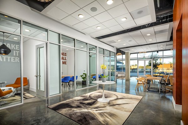 Aston at Gateway Apartments: Contemporary clubhouse featuring modern decor and spacious seating