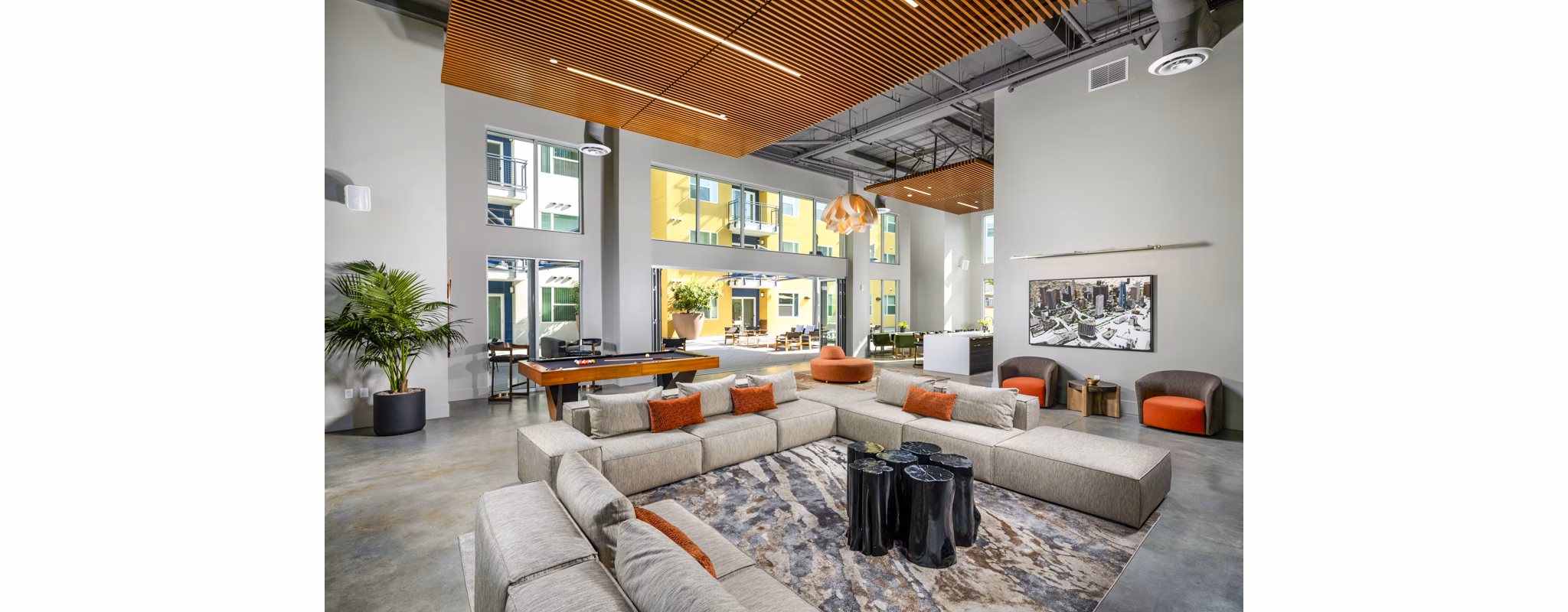 Elegant clubhouse featuring modern decor and ample seating at Aston at Gateway Apartments, a luxury living space